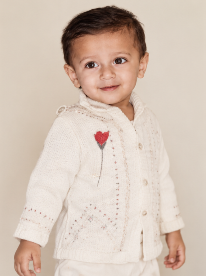 Asim Yaqoob as a young child in a cream sweater